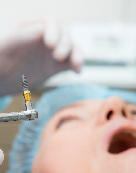 A patient undergoing dental implant surgery