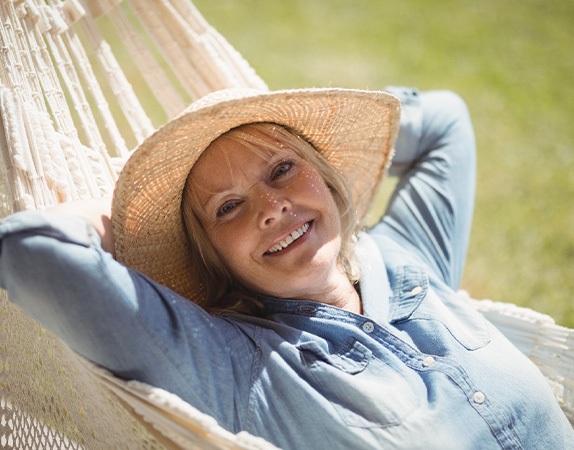 A woman relaxing in a hammock