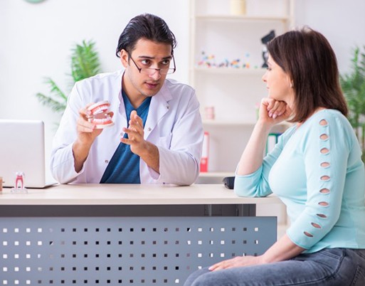 Woman listening to dentist during consultation