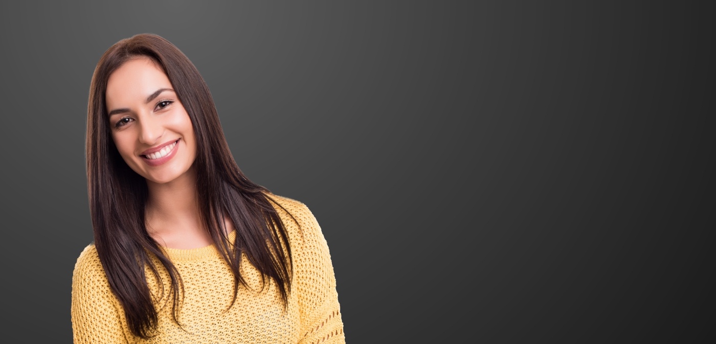 Smiling woman in yellow sweater