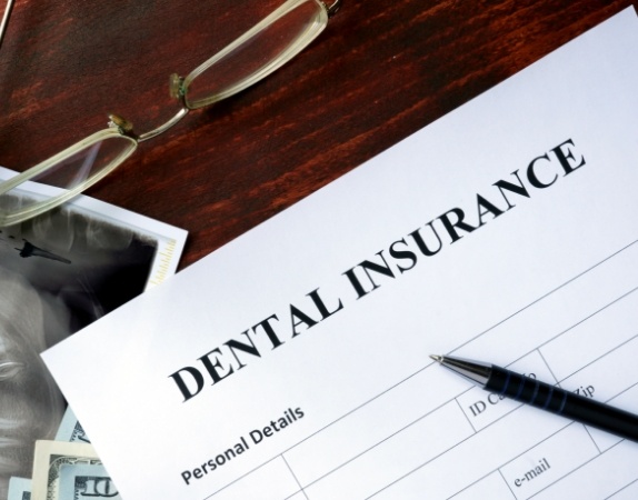 Dental insurance paperwork on desk