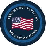 Badge with American flag and text that says serving our veterans see how we serve