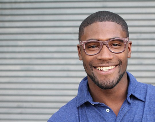 Charlotte patient smiling after cosmetic dental bonding