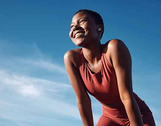 Lady smiles outdoors?