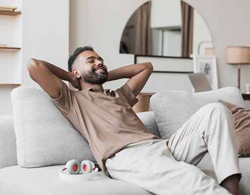 Man smiling while relaxing at home
