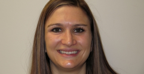 Woman grinning before Invisalign treatment