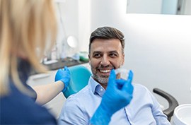 Patient in McAlpine smiling as they receive Invisalign