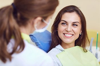 Patient smiling at her dentist