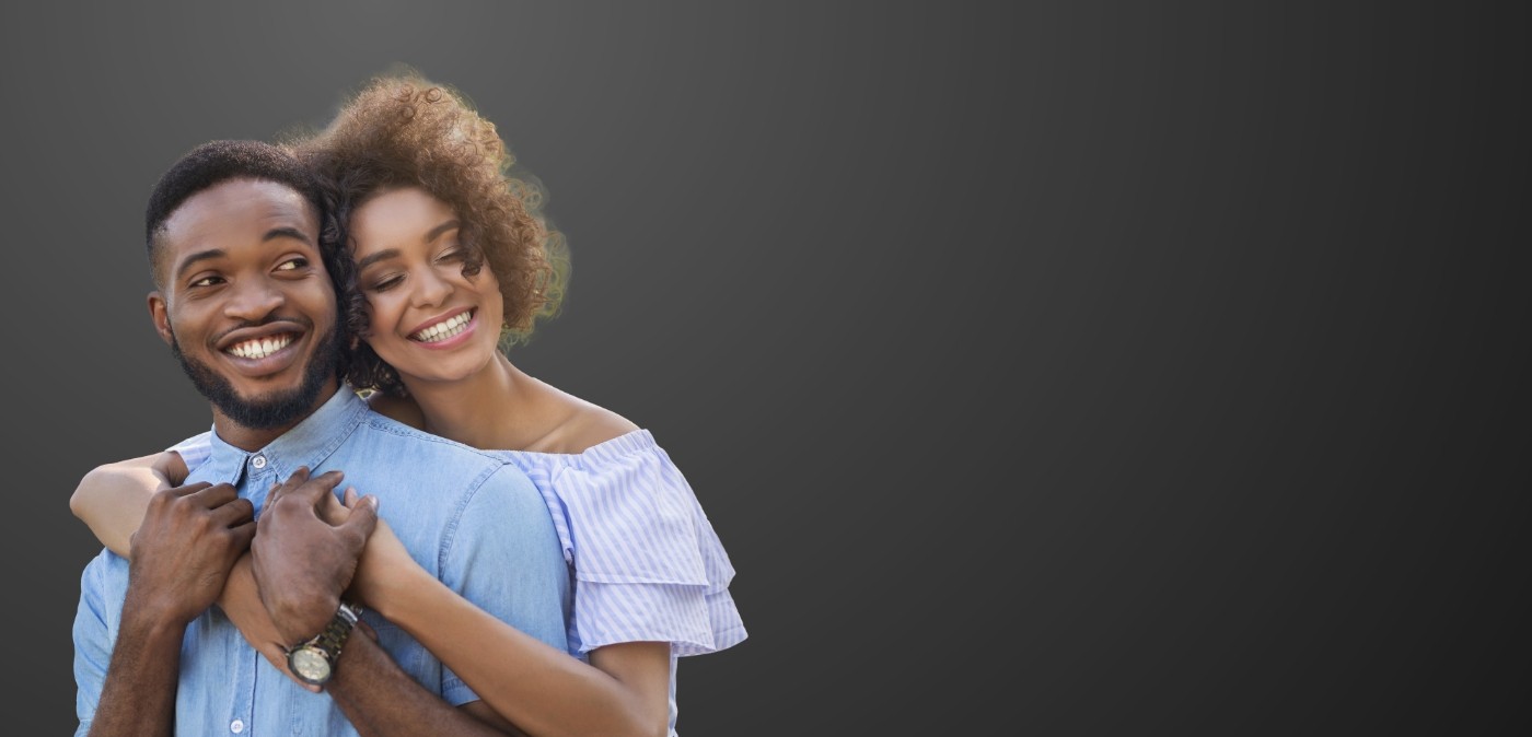 Smiling man and woman embracing