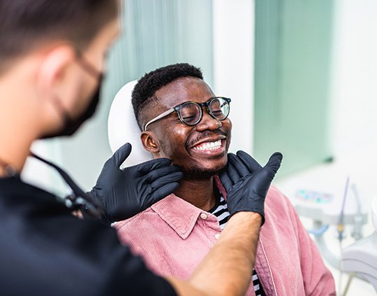 Man smiling at the dentist